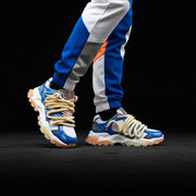 Colorful sneakers with unique laces worn by a person on a black background